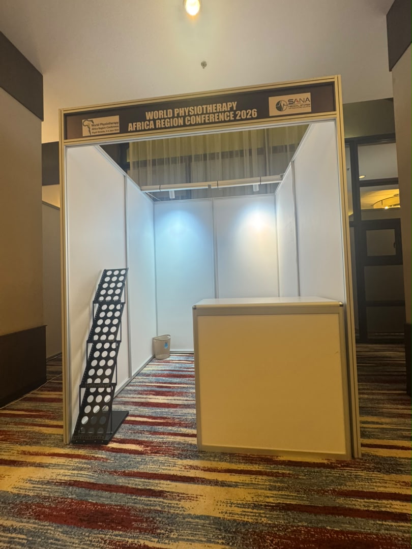 Open-air shell scheme booths with counters and brochure racks